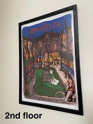 a framed painting of a house in a city at Bel appartement proche de tout in Brussels