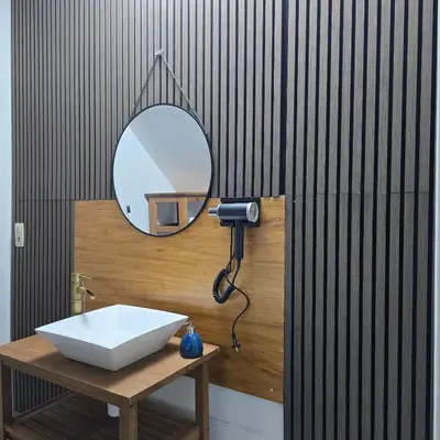 a bathroom with a sink and a mirror at Balacobaco in Brussels