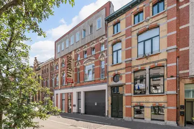 an old brick building on a city street at Luxury apartment x big terrace in Sint-Niklaas
