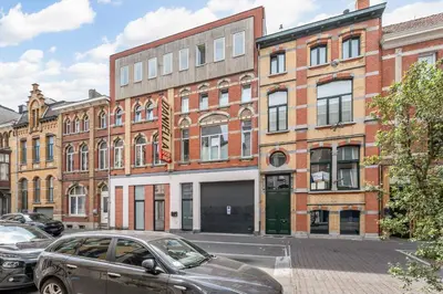 a car parked in front of a brick building at Luxury apartment x big terrace in Sint-Niklaas