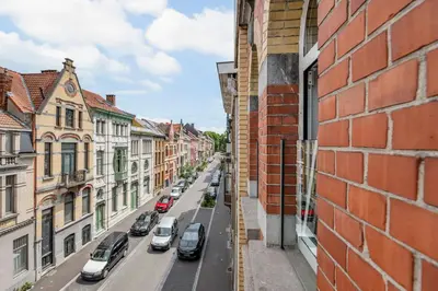 a view of a city street from a building at Luxury apartment x big terrace in Sint-Niklaas