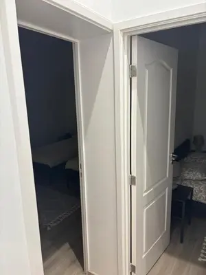 an open door to a room with a bedroom at Appartement Leyla in Brussels
