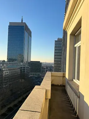 a balcony of a building with a view of a city at Lovely loft in Panoramic View! in Brussels
