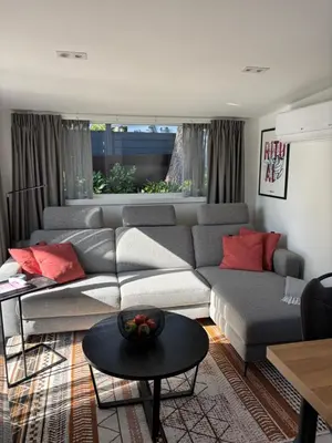 a living room with a couch and a table at Nomad Laryssiou on camping GT Keiheuvel parcel 371 in Balen