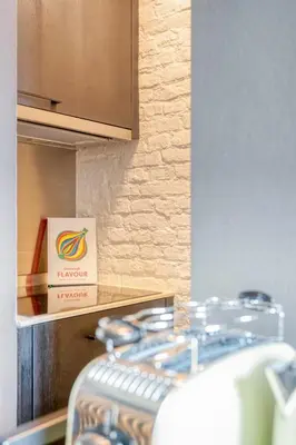 a box sitting on top of a counter in a kitchen at Serene Studio Oasis with Balcony in Ghent in Ghent