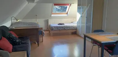 a room with a bed and a desk with a desk at Cosy apartment in Brasschaat near Antwerp in Brasschaat