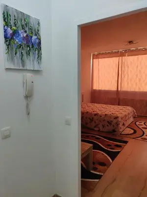 a room with a bed and a door with a window at Lisbethe in Brussels