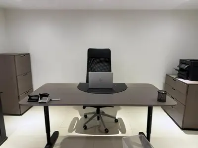 a desk with a laptop computer on top of it at l'imperial WIFI & Confort in Brussels