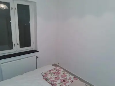 a bedroom with a bed and a window at House near Forest 125 m² for 6 guests in Brussels