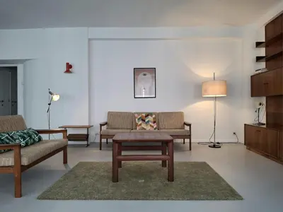 a living room with two chairs and a coffee table at Central in the heart of Brussels in Brussels