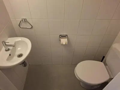a bathroom with a toilet and a sink at Central in the heart of Brussels in Brussels