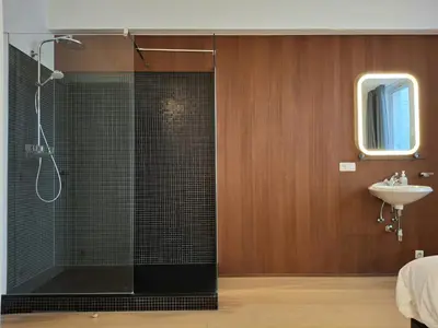 a bathroom with a shower and a sink at Central in the heart of Brussels in Brussels