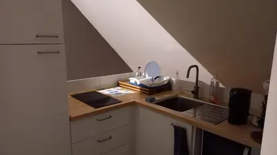 a kitchen with a sink and a counter top at Julie's Place in Westerlo