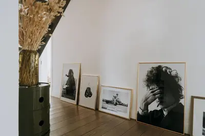 a room with pictures on the wall and a vase at Magnificent loft - 3 bedroom duplex in Brussels