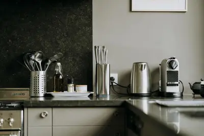 a kitchen counter with utensils and appliances on it at Magnificent loft - 3 bedroom duplex in Brussels