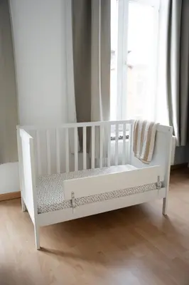 a white crib in a room with a window at Cozy and luxurious apartment in Brussels, Laeken in Brussels