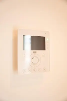a white microwave oven on a white wall at Cozy and luxurious apartment in Brussels, Laeken in Brussels