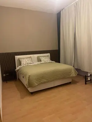 a bedroom with a bed and a window at Cozy and luxurious apartment in Brussels, Laeken in Brussels