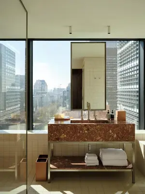 a bathroom with a sink and a large mirror at The Standard, Brussels in Brussels