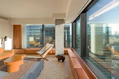 a living room with a view of a city at The Standard, Brussels in Brussels