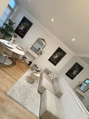 a living room with a couch and a table at Charming studio, perfect getaway in Brussels