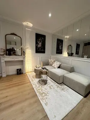 a living room with a couch and a table at Charming studio, perfect getaway in Brussels