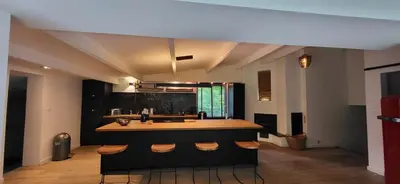 a kitchen with a island with a counter top at Stavros in Schoten