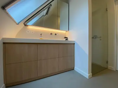 a bathroom with a sink and a large window at Oase d'Itegem - Wellness & Luxe in Heist-op-den-Berg