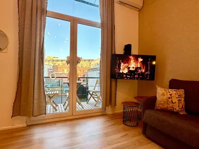 a living room with a large window with a view at Luxury Suites Royal by Rikas Hotels in Antwerp