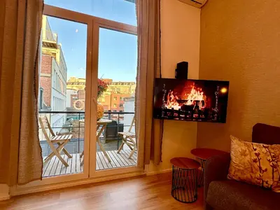 a living room with a large window with a view at Luxury Suites Royal by Rikas Hotels in Antwerp