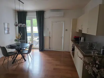 a kitchen and dining room with a table and chairs at Lovely & Modern apartment in the heart of Antwerp in Antwerp