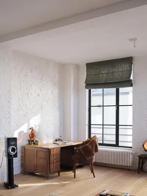 a living room with a desk and a large window at Brooklyn Five in Ghent