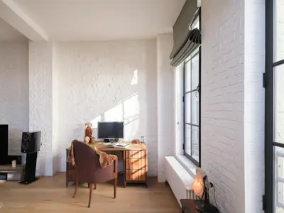 a room with a desk with a computer and a window at Brooklyn Five in Ghent