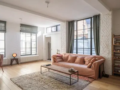 a living room with a couch and a coffee table at Brooklyn Five in Ghent