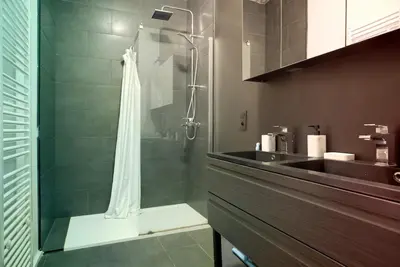 a bathroom with a shower and a sink at 2BR Apartment AA Location Antwerp in Antwerp
