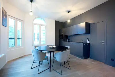 a kitchen with a table and chairs in a room at 2BR Apartment AA Location Antwerp in Antwerp