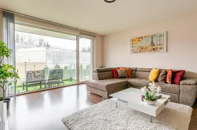 a living room with a couch and a table at The Stalle in Brussels