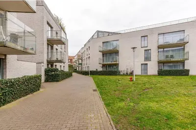 an empty sidewalk in front of some buildings at The Stalle in Brussels