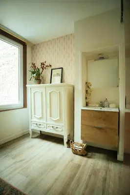 a bathroom with a sink and a mirror at The Cozy Guestroom near Park Zuid and Musea in Antwerp