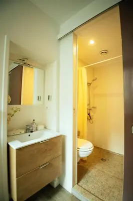 a bathroom with a sink and a toilet at The Cozy Guestroom near Park Zuid and Musea in Antwerp