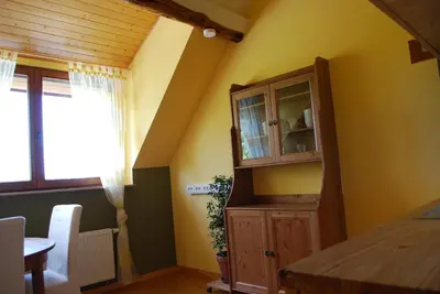 a kitchen with a cabinet and a table and a window at Huis van Rooi in Sint-Agatha-Rode