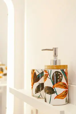 a bathroom shelf with a soap dispenser on it at Absolute Charm 3 Bedroom 3 Bathroom with AC EU District in Brussels