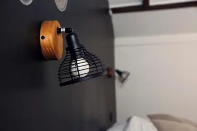 a light hanging on a wall in a bedroom at Absolute Charm 3 Bedroom 3 Bathroom with AC EU District in Brussels