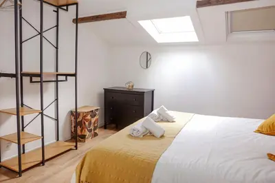 a bedroom with a bed with two pillows on it at Absolute Charm 3 Bedroom 3 Bathroom with AC EU District in Brussels