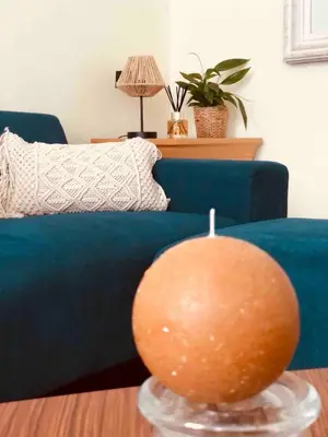 a living room with a blue couch and a ball on a table at Cosy 1 bedroom apartment in EU DISTRICT in Brussels