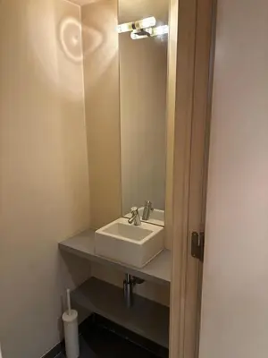 a bathroom with a sink and a mirror at Comfortable Two bedroom Apartment in City Center in Brussels