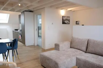 a living room with a couch and a table at Blu shell house in Brussels