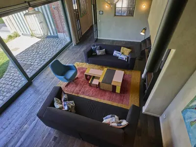 an overhead view of a living room with couches and a table at Villa Lactea in Schilde