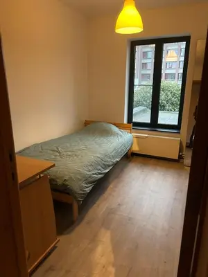 a bedroom with a bed and a window at SiSEL HOUSE avaible with garden for 6 or more people! in Temse