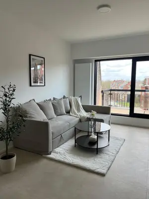 a living room with a couch and a table at Luxury Duplex near Expo 12 & ING Arena & Atomium in Wemmel